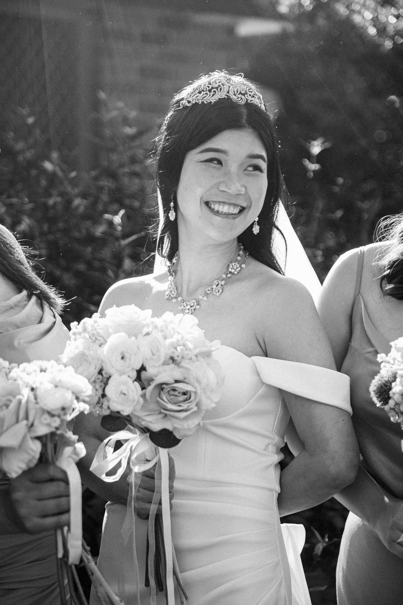 Huiyu stunning black and white portrait with crystal tiara and bridesmaids holding rose bouquets