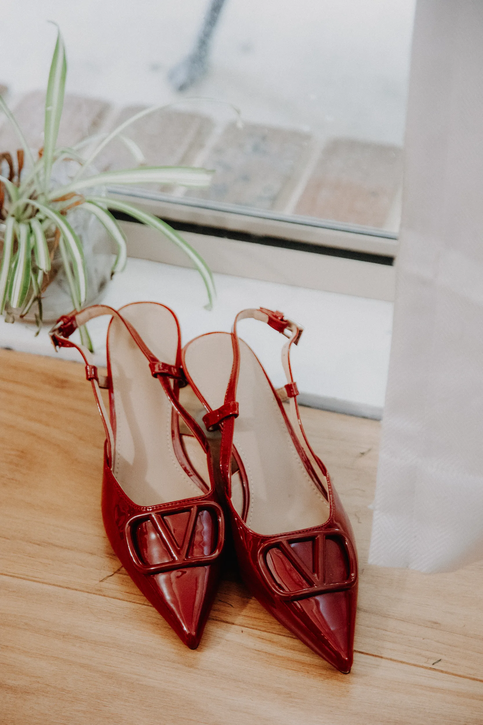 Huiyu and Chris wedding detail shot of red Valentino slingback heels with V logo luxury accessories